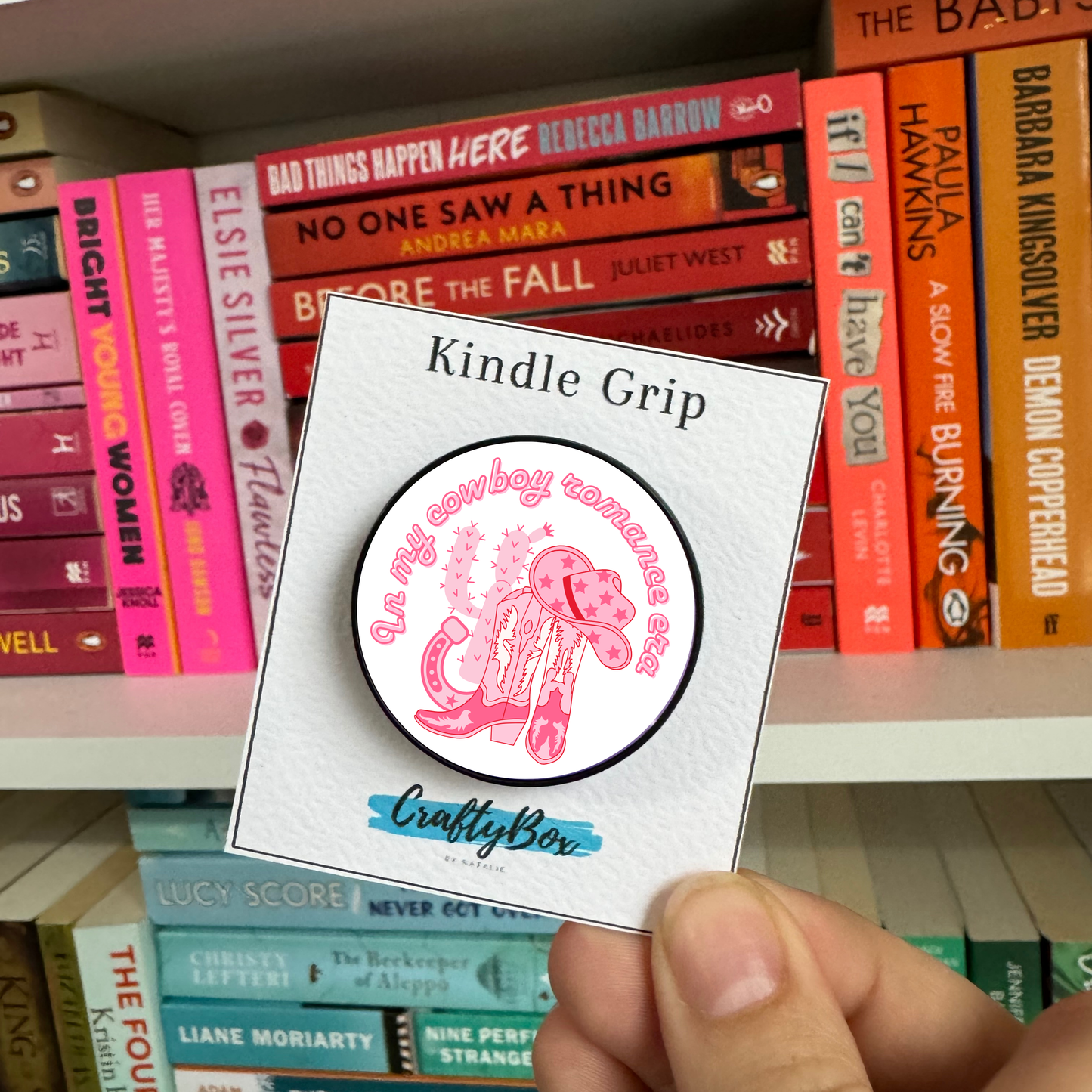 In my Cowboy Romance Era Kindle/eReader Grip